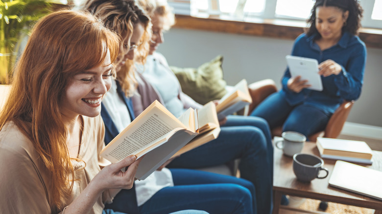 Women at a book club reading