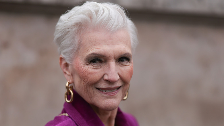 Woman poses with gray hair