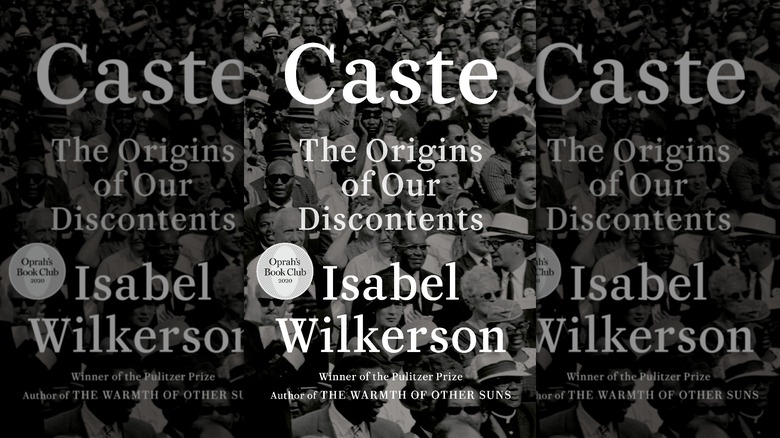 The cover of "Caste" by Isabel Wilkerson, featuring a sepia crowd shot