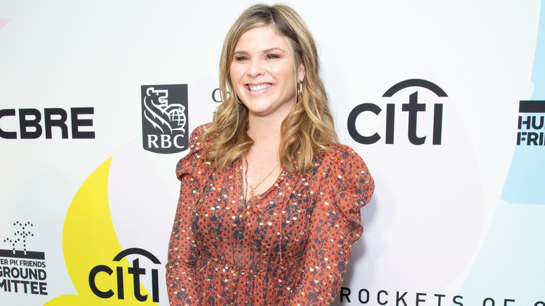 Jenna Bush Hager smiling at an event wearing a printed dress