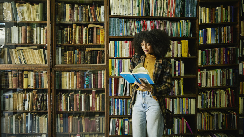 Woman at a bookstore reading