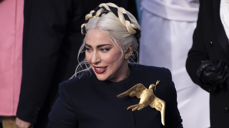 Lady Gaga at the inauguration with large dove brooch