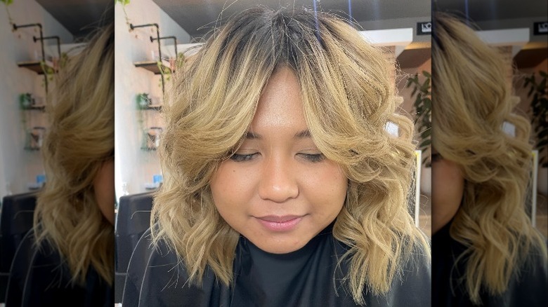 Woman with blonde layered haircut