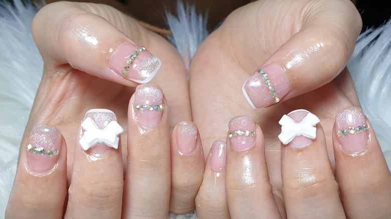 Woman with bows on her nails 