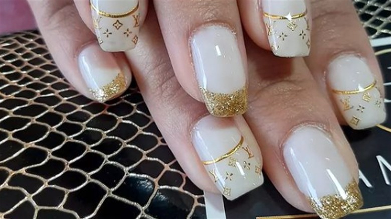 Logomania on a French manicure