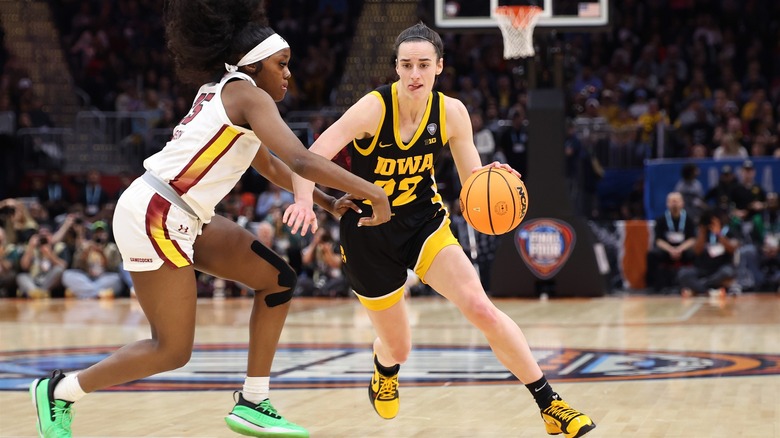 Caitlin Clark playing basketball