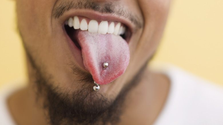 Tongue sticking out with piercing