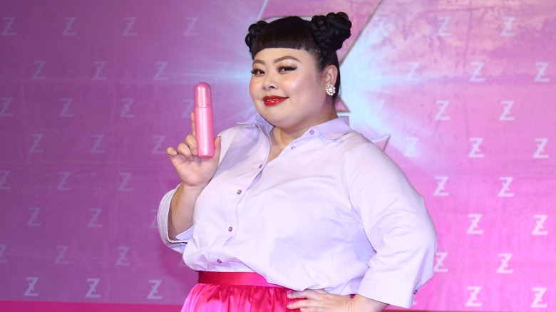 Naomi Watanabi posing with deodorant