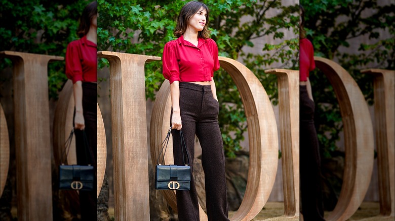 Woman in brown pants and red top 