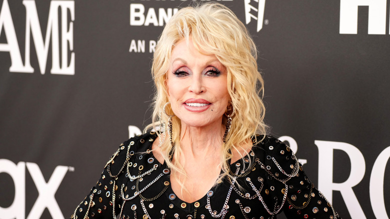 Dolly Parton smiling at an event in 2022