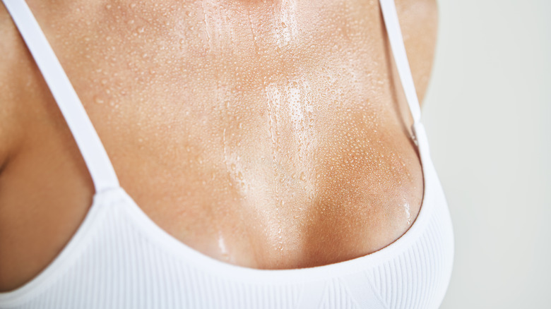 Woman sweating in bra