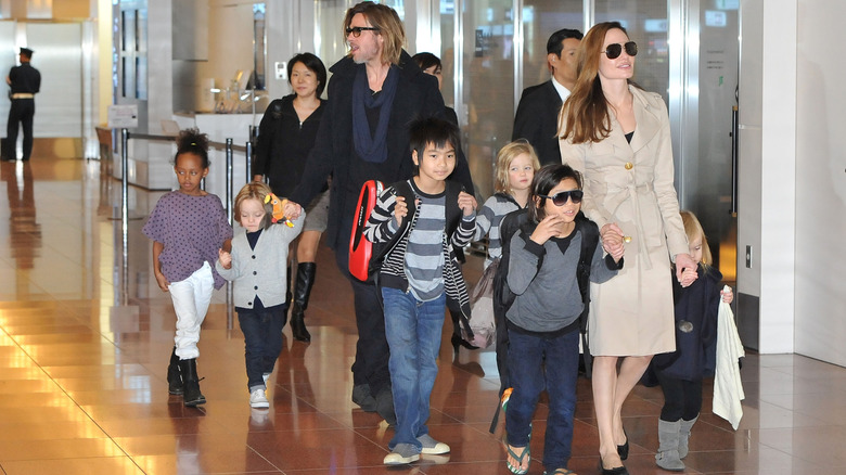 Brad Pitt and Angelina Jolie and kids at an event