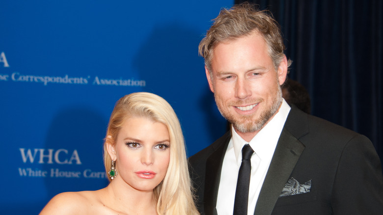 Jessica Simpson in a strapless dress and Eric Johnson in a black suit at an event