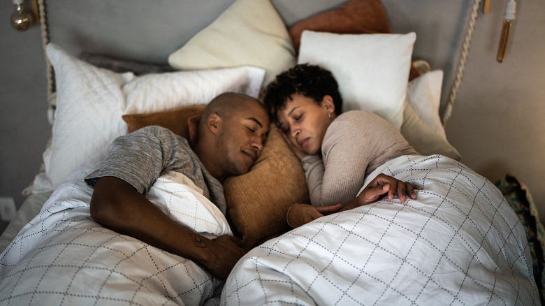 couple asleep in bed