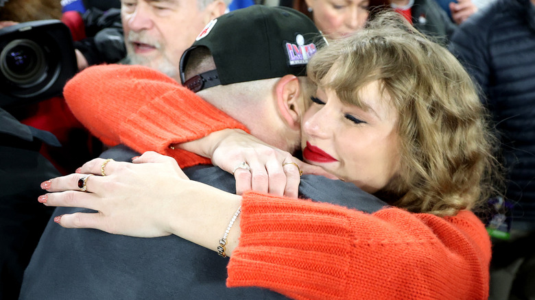 Taylor Swift hugging Travis Kelce