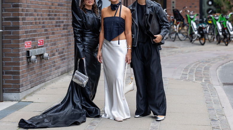 three models and three silk skirts