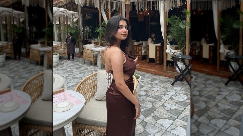 Wearing brown dress