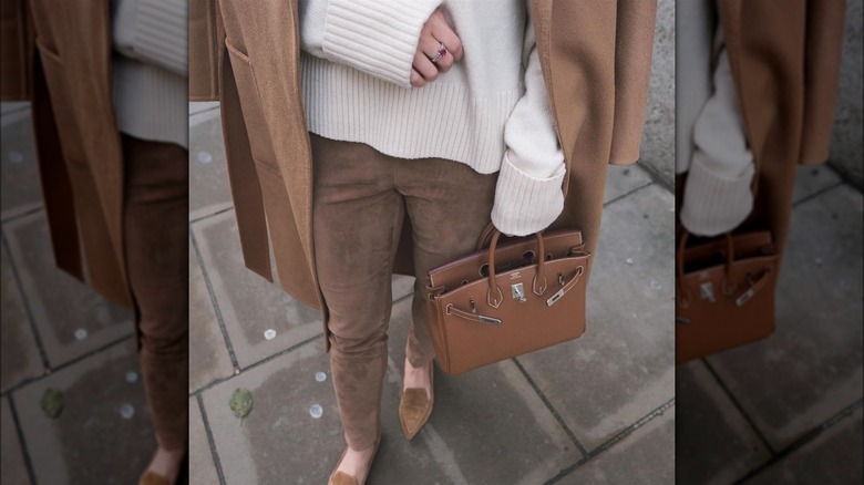 Woman carrying a brown bag