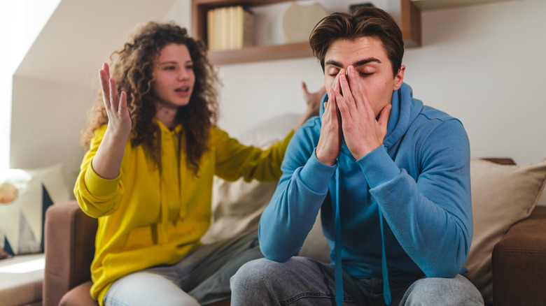 Man not listening to upset woman