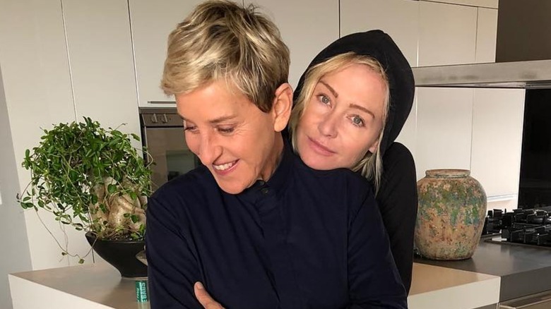 Portia De Rossi hugging Ellen DeGeneres