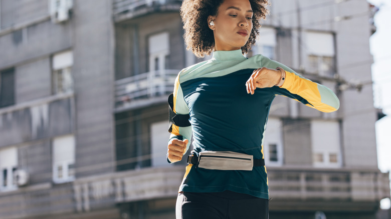 woman checking her smart watch