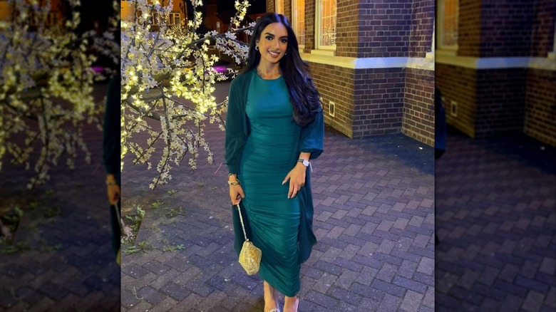 Wearing emerald dress