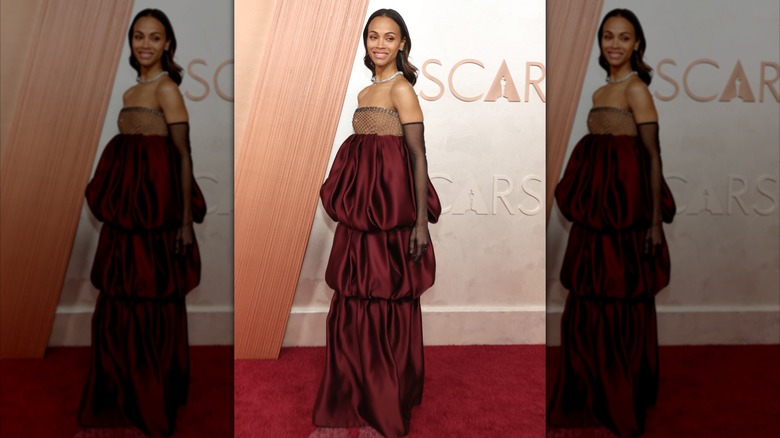 Zoe Saldana in a red dress at the 2025 Oscars