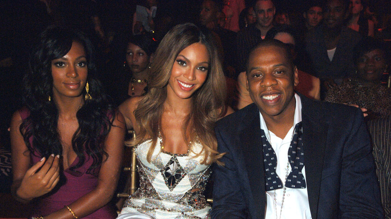 Solange Knowles with Beyoncé and Jay-Z