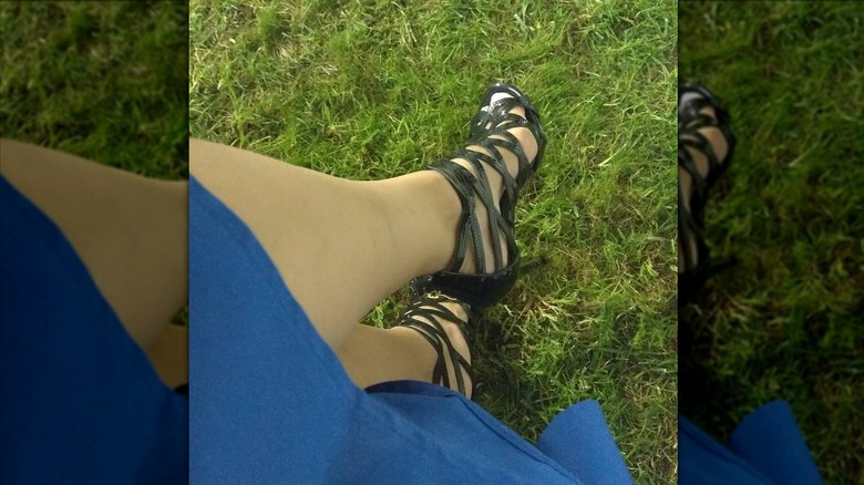 Stiletto heels on grass