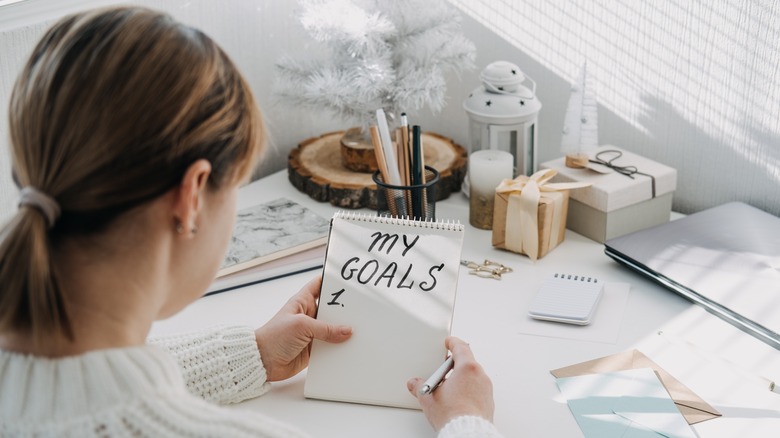 Person writing down their goals