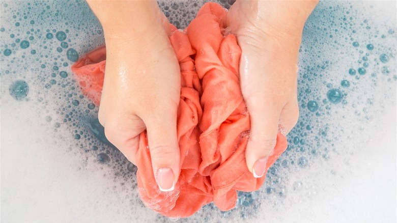 Woman hand-washing clothes