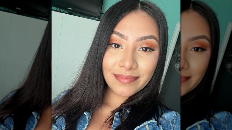 Woman wearing orange eyeshadow