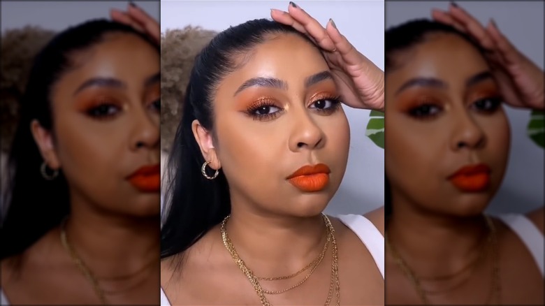 Woman wearing orange lipstick