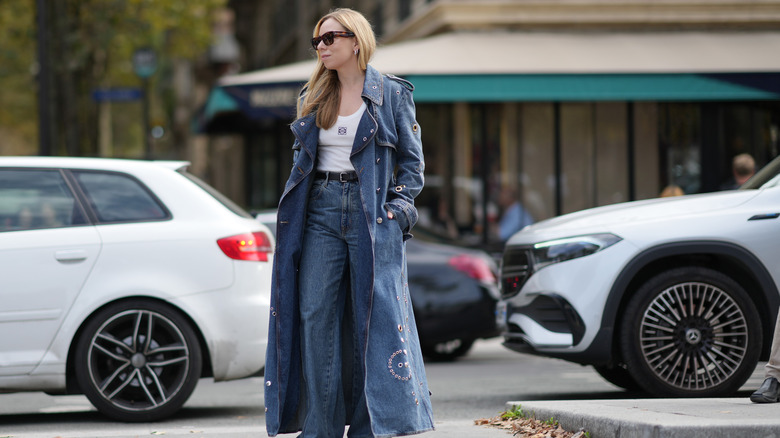 Woman wears denim coat with denim jeans