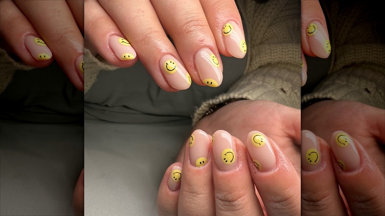 Yellow smiley face nails