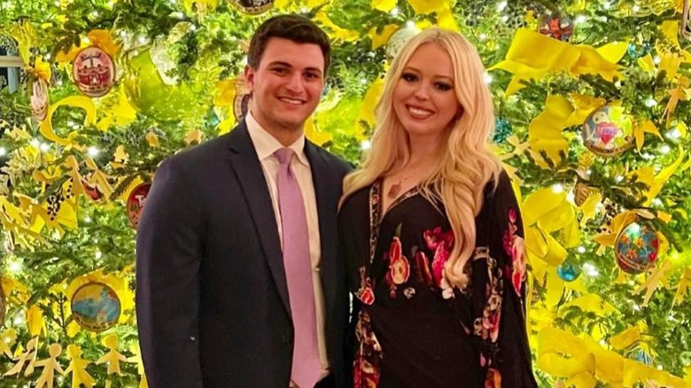 Michael Boulos with Tiffany Trump in front of a Christmas tree