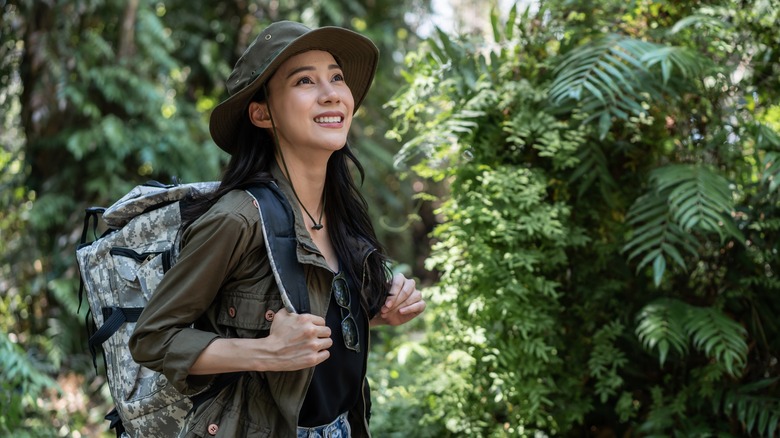 Woman smiling while hiking 