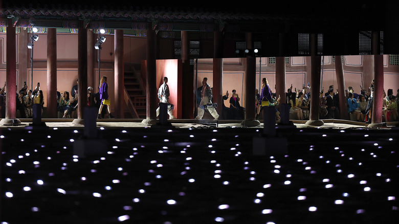 Models walk the runway at the Gucci Cruise fashion show in Seoul