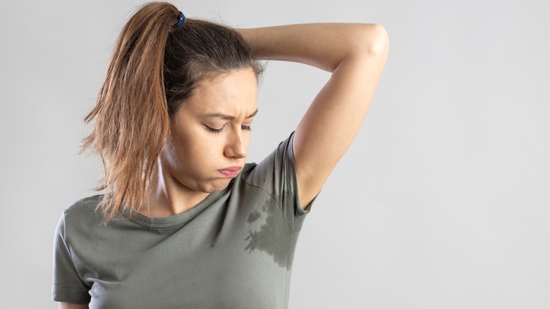 Woman looking at pit stain