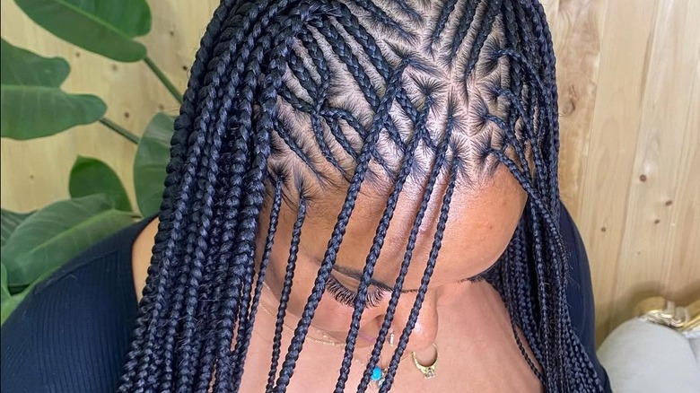 A woman wearing Fulani braids