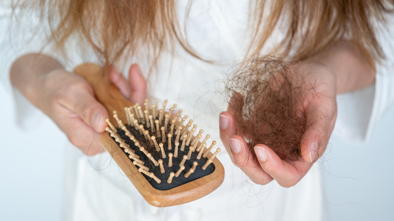 Hairbrush with accompanying hair