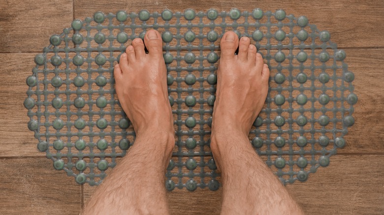 Feet on shower mat
