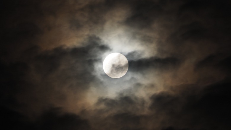 Full moon covered by clouds