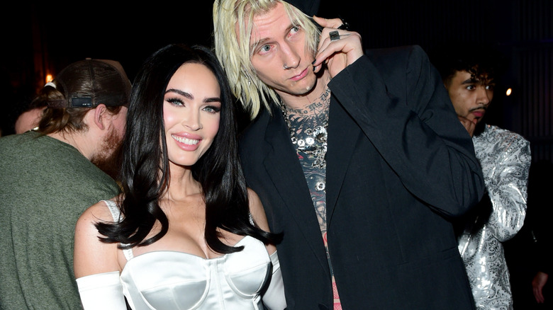 Megan Fox and Machine Gun Kelly out at an event