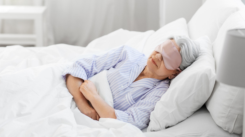 Woman sleeping wearing sleep mask
