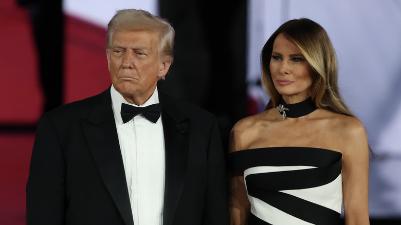 Donald Trump in a tuxedo and Melania Trump in a black choker and a black and white dress