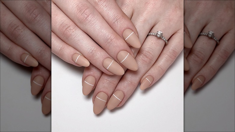 Nude matte nails with a stripe