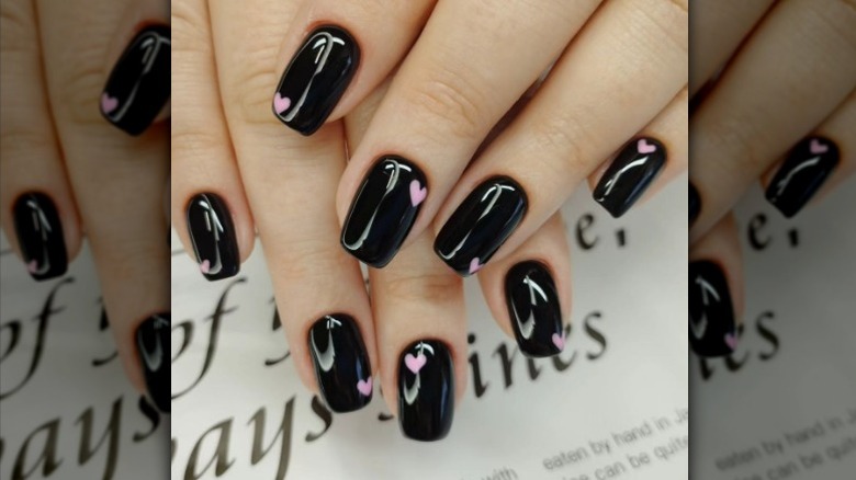 Black nails with pink hearts