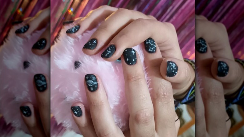Black constellation nail art