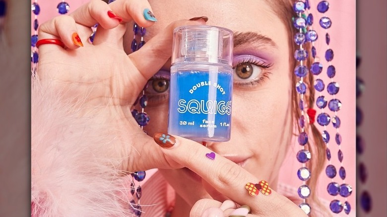 Girl holding Squigs product
